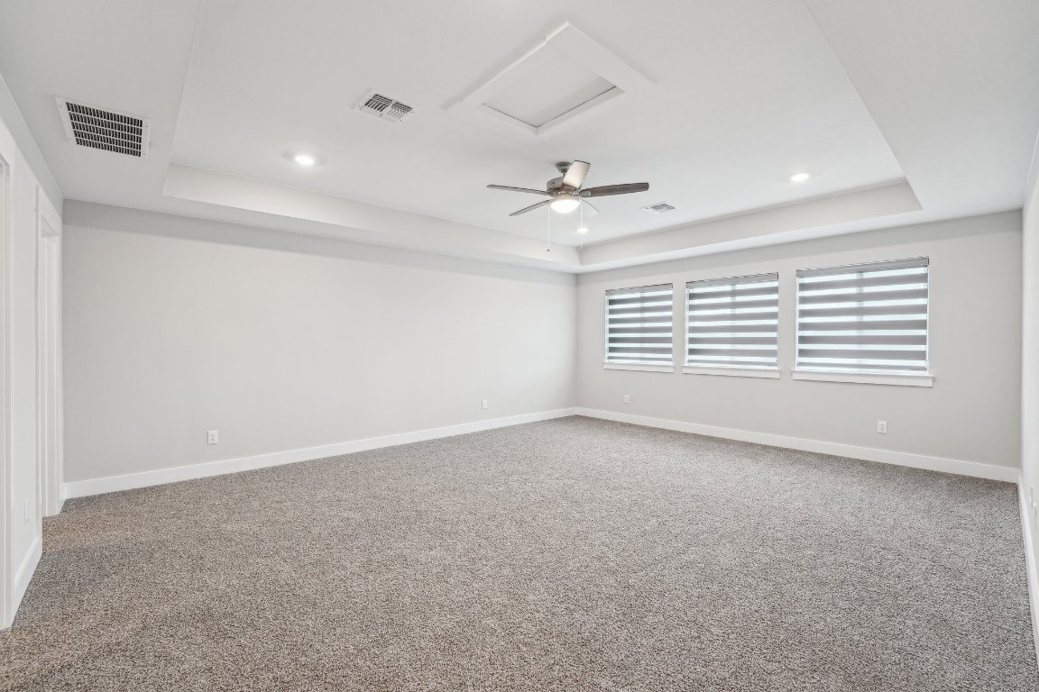 4216 Caroline Mae Cove Pflugerville, TX 78660 - Photo 27 of 32 a view of an empty room with a window
