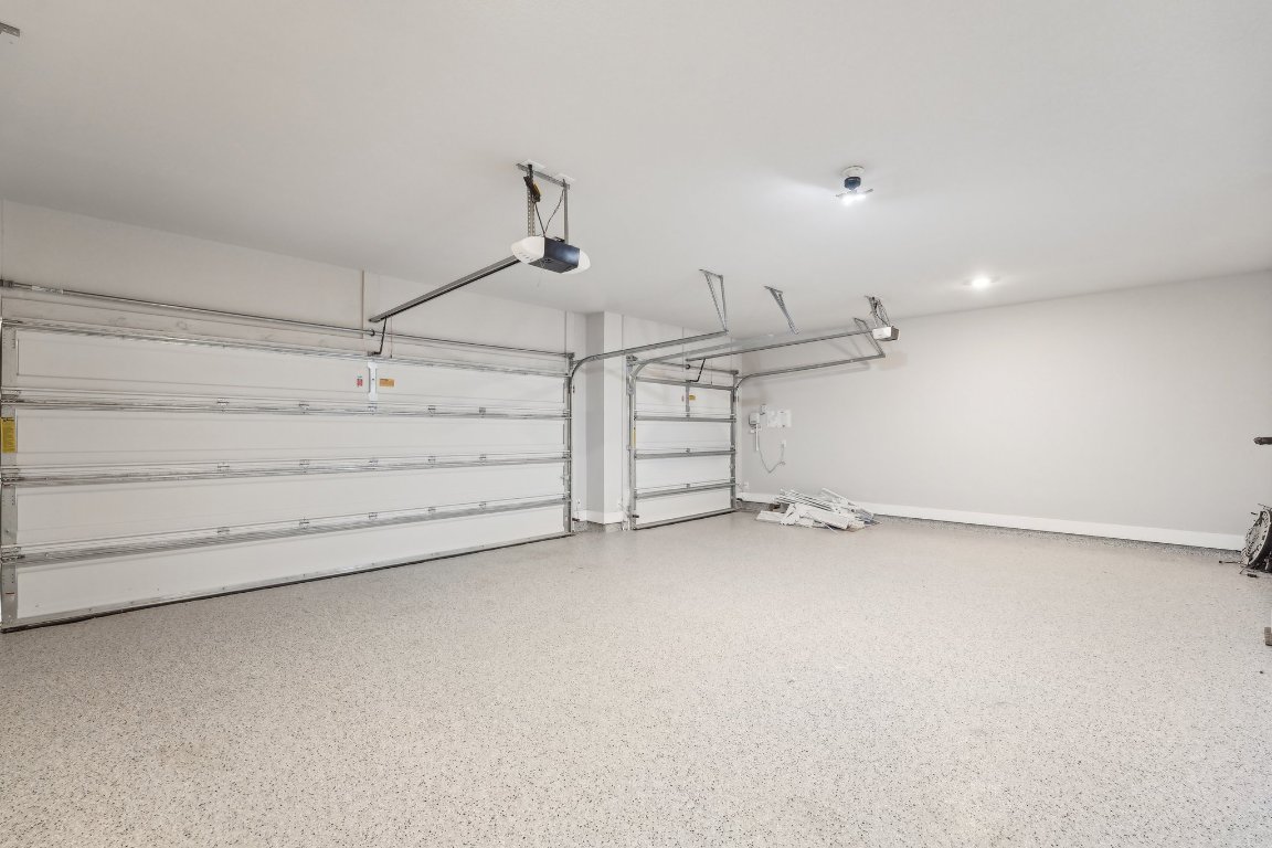 4216 Caroline Mae Cove Pflugerville, TX 78660 - Photo 32 of 32 a view of a room with racks on the wall