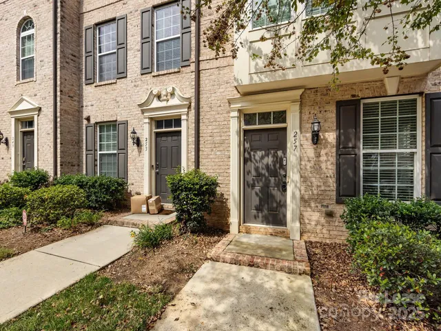 a view of a building with potted plants