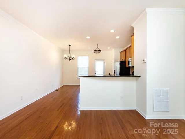 a view of a kitchen from the hallway