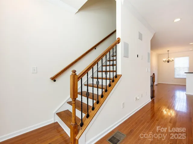 a view of an entryway with wooden floor