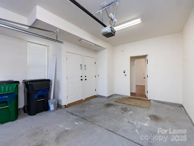 a view of empty room with a fireplace and ceiling fan