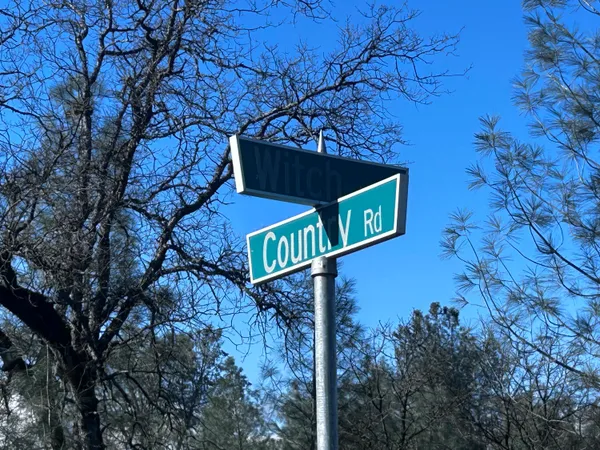 a street sign on a pole on a street
