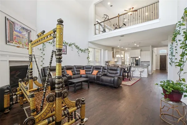 a living room with lots of furniture and a fireplace