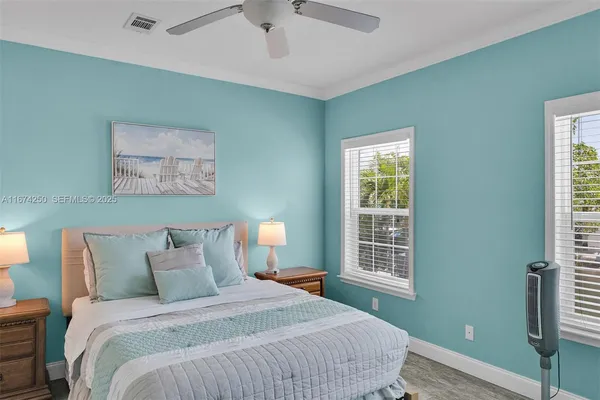 a bedroom with bed and window