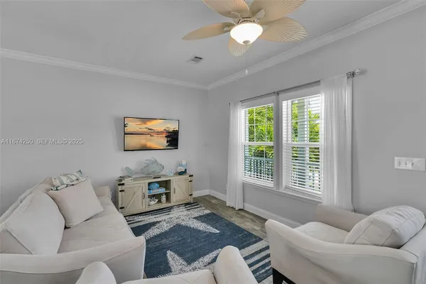 a living room with furniture and a window