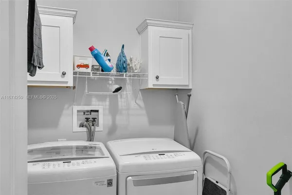 a utility room with dryer and washer