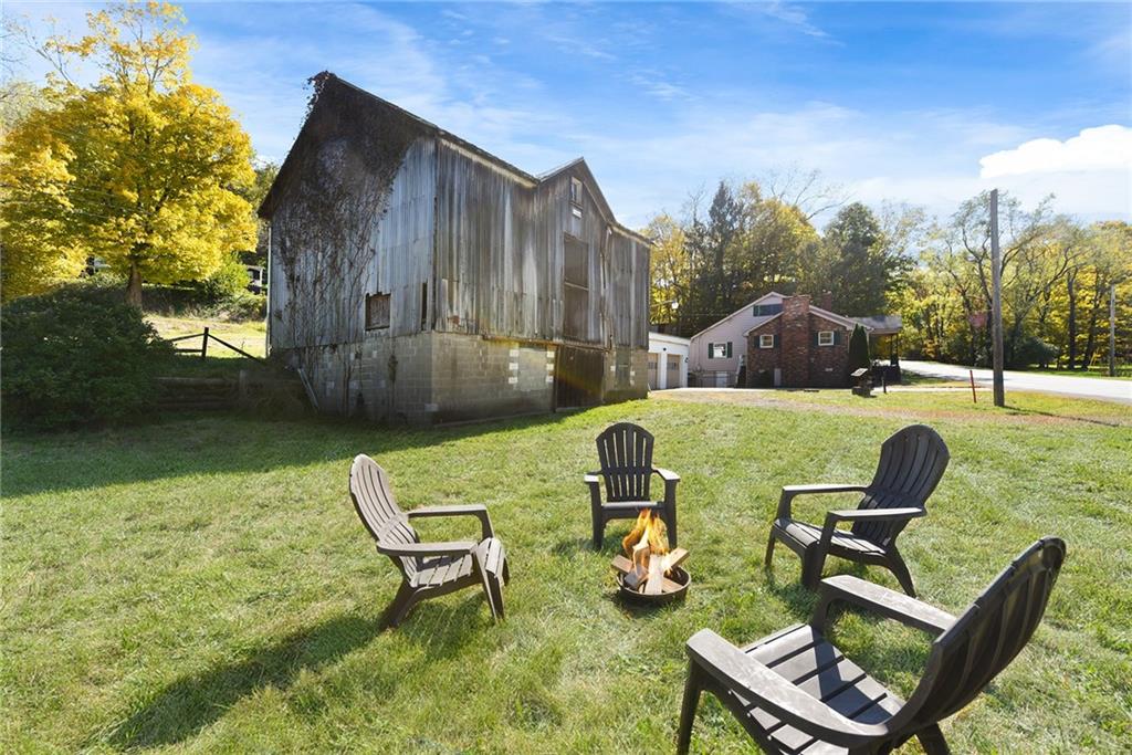 1190 Rte 481 Charleroi, PA 15022 - Photo 26 of 32 a view of a chair and table in backyard of the house