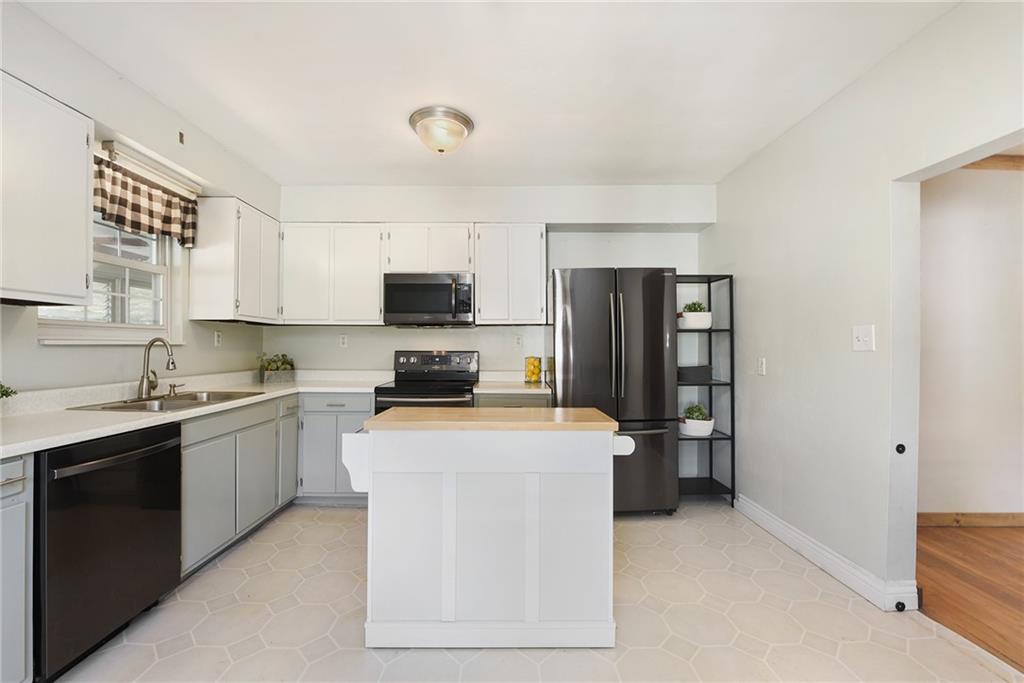 1190 Rte 481 Charleroi, PA 15022 - Photo 8 of 32 a kitchen with stainless steel appliances a stove refrigerator sink and microwave