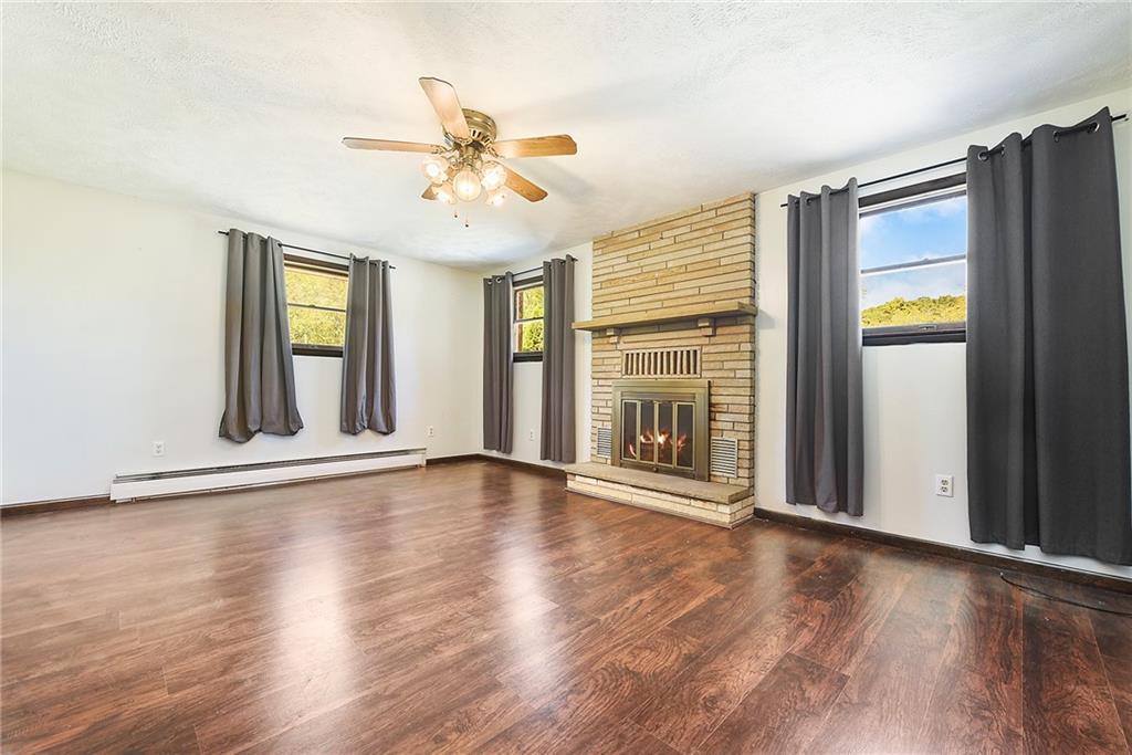 1190 Rte 481 Charleroi, PA 15022 - Photo 9 of 32 a view of an empty room with wooden floor and a window