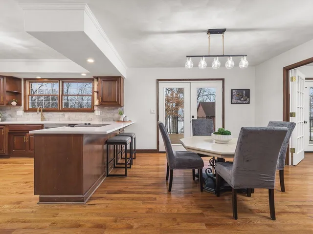 a kitchen with stainless steel appliances granite countertop a sink and refrigerator