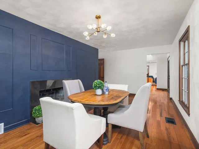 a bathroom with a granite countertop sink a toilet a shower and a mirror