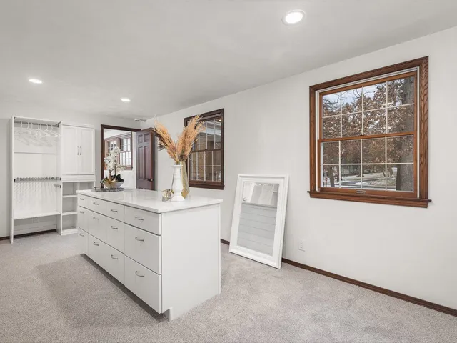 an aerial view of a house with a big yard