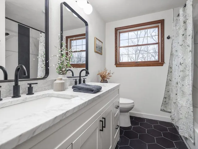 a view of a lake with a house in the background