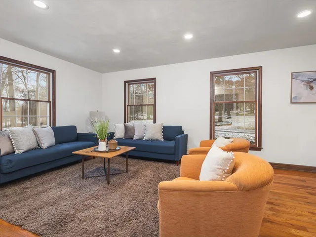a view of a livingroom with furniture and wooden floor