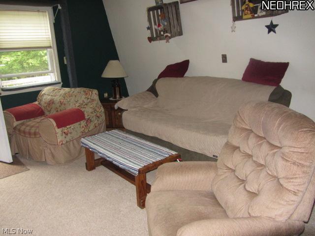 4315 John Thomas Road Ravenna, OH 44266 - Photo 3 of 10 The living room is roomy with a high ceiling and exposed beam. Very nice.