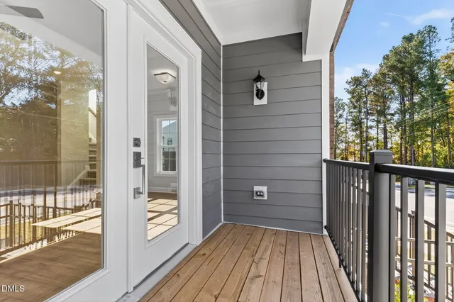 a view of a balcony with wooden floor