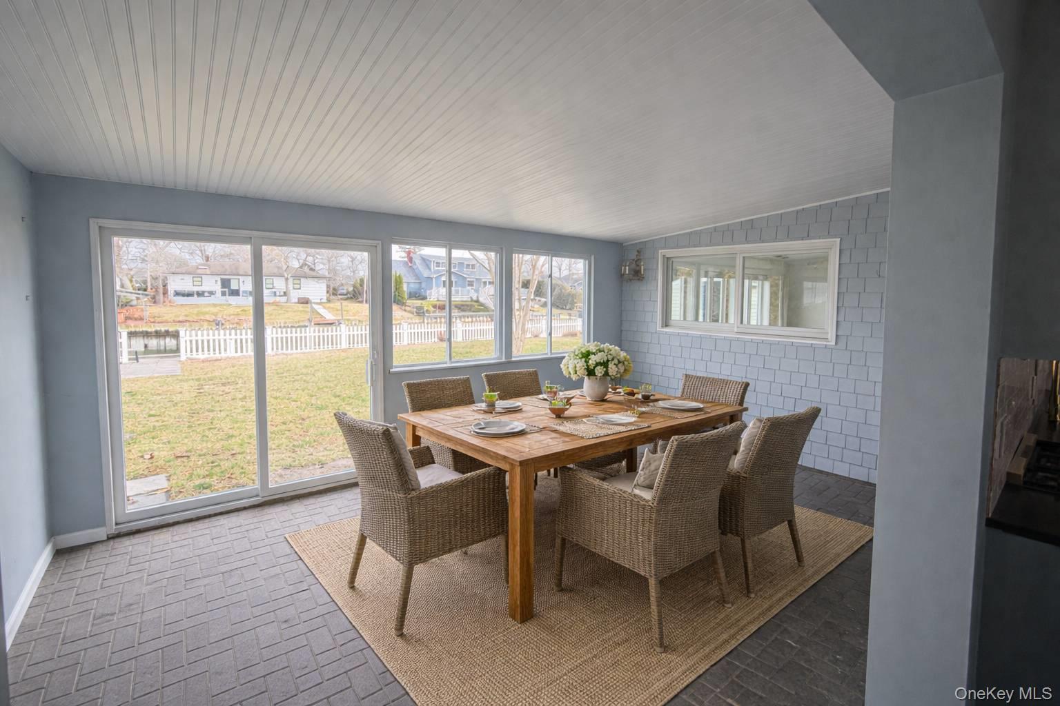 21 Tarpon Road East Quogue, NY 11942 - Photo 15 of 18 a view of a dining room with furniture and window
