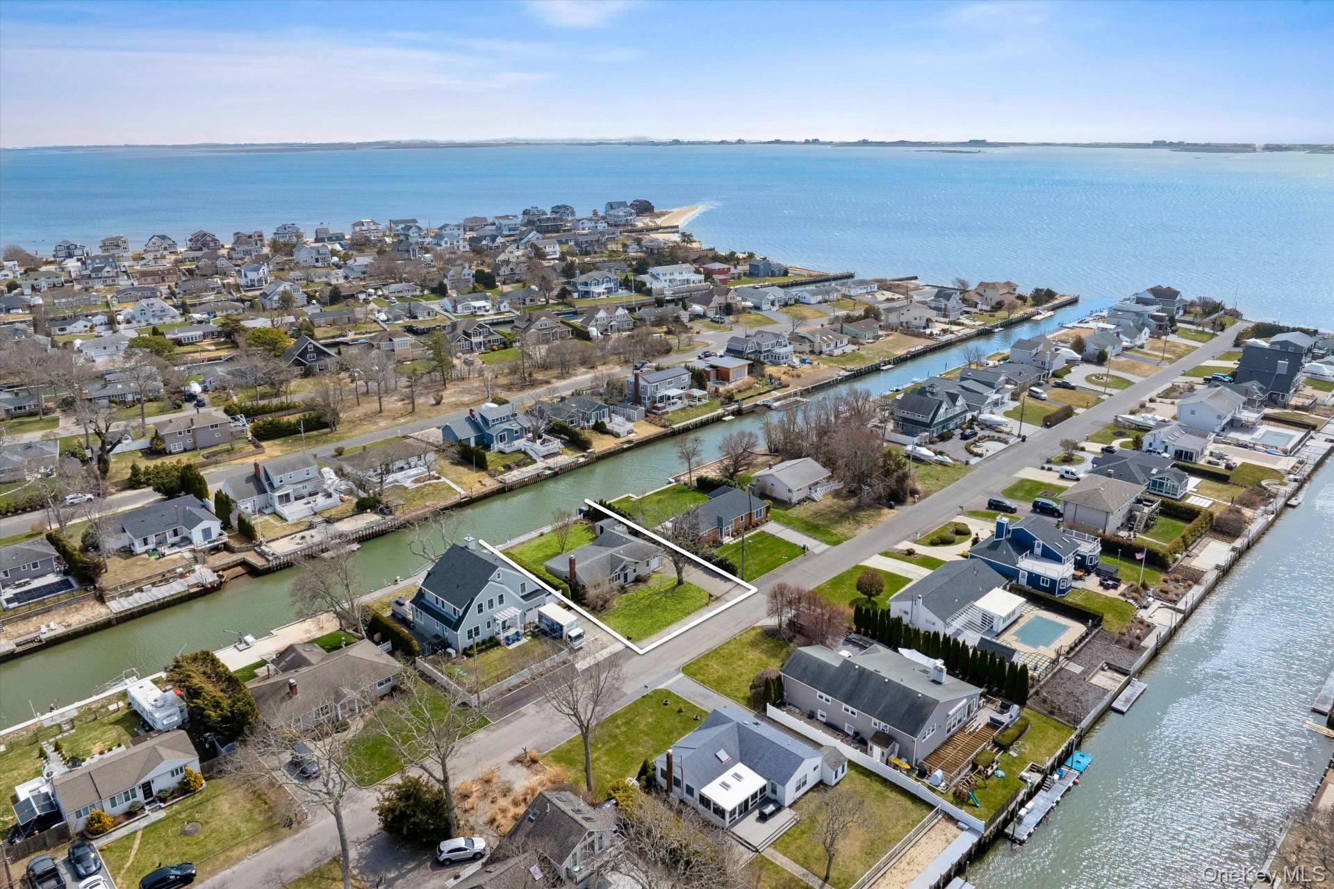 21 Tarpon Road East Quogue, NY 11942 - Photo 17 of 18 an aerial view of residential houses with outdoor space