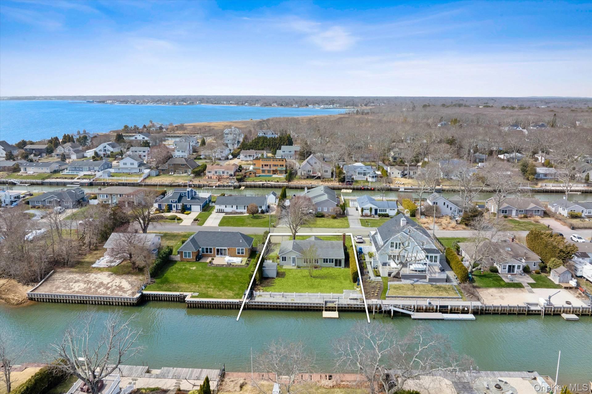 21 Tarpon Road East Quogue, NY 11942 - Photo 18 of 18 an aerial view of houses with yard swimming pool and ocean view