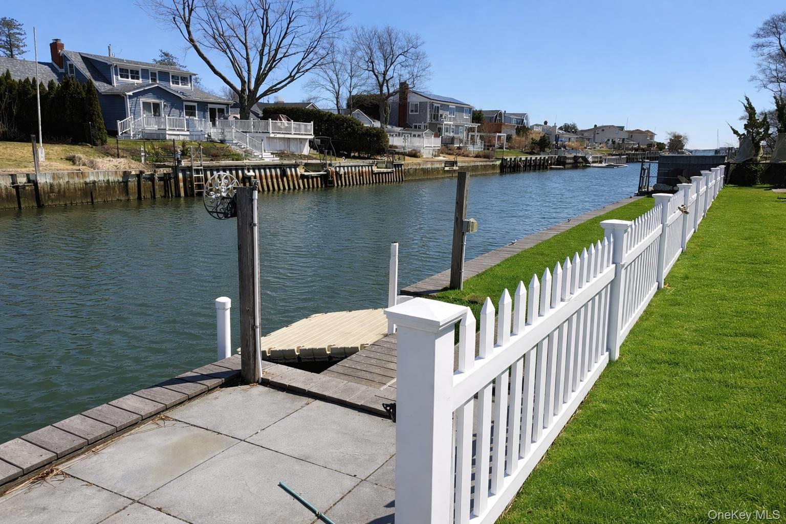 21 Tarpon Road East Quogue, NY 11942 - Photo 4 of 18 a view of a lake from a balcony