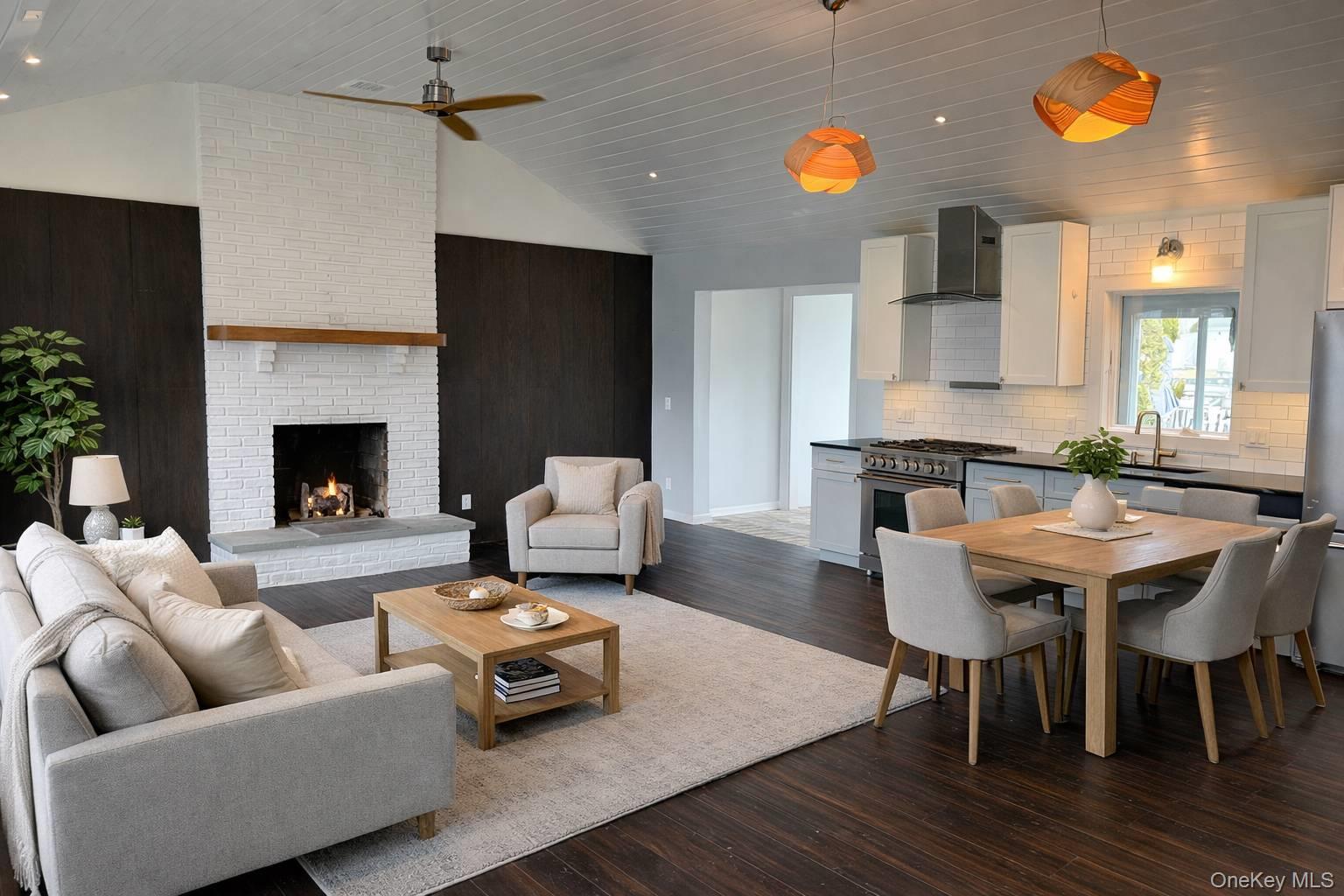 21 Tarpon Road East Quogue, NY 11942 - Photo 9 of 18 a living room with furniture and a fireplace