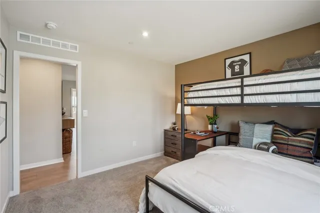 a bed room with a bed and a window