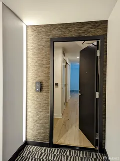 a kitchen with stainless steel appliances granite countertop a refrigerator a sink and a stove