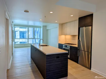 a kitchen with stainless steel appliances a sink and a stove