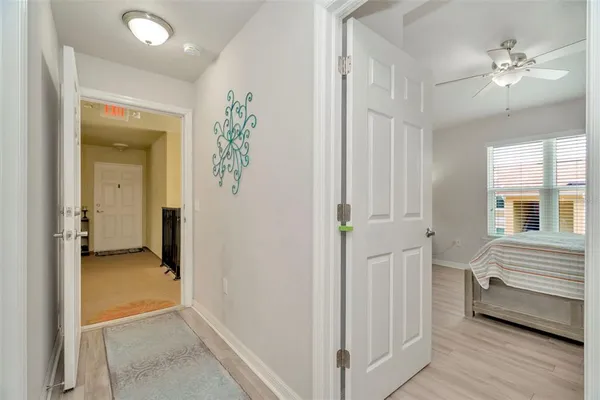 a view of livingroom with hardwood floor and a ceiling fan