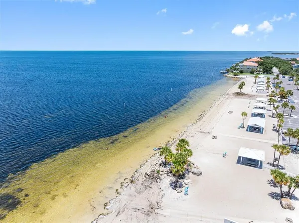 a view of a swimming pool with an outdoor seating
