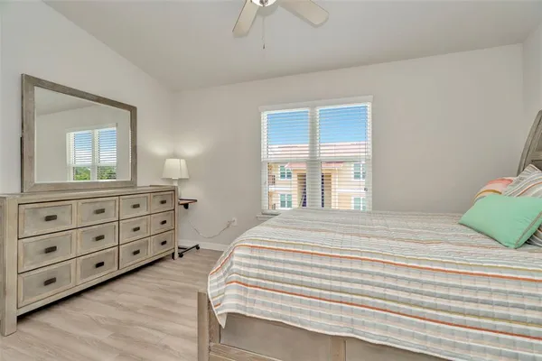 a bedroom with a bed and a dresser