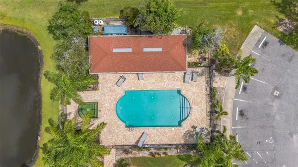 an aerial view of a house with a swimming pool