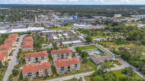 an aerial view of residential houses with outdoor space