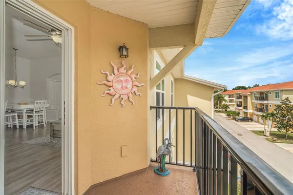 a view of a balcony and chairs