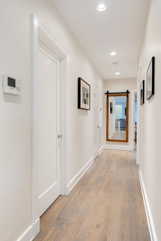 405 West First Street, Unit 303 Boston, MA 02127 - Photo 12 of 29 a view of a big room with wooden floor and windows