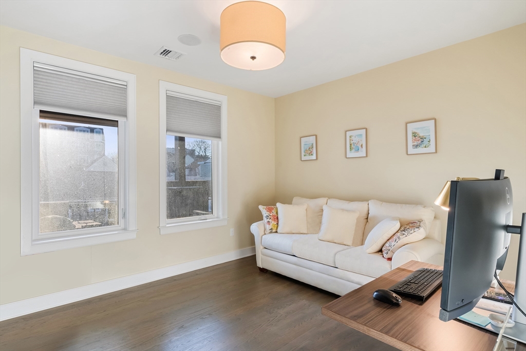 405 West First Street, Unit 303 Boston, MA 02127 - Photo 19 of 29 a living room with furniture and a window