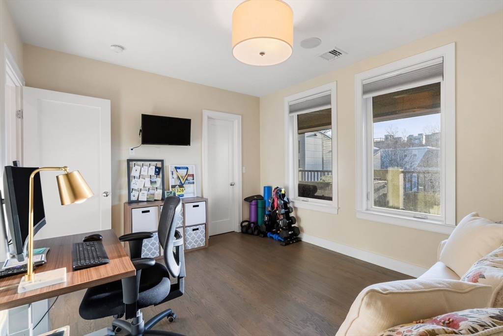 405 West First Street, Unit 303 Boston, MA 02127 - Photo 20 of 29 a view of a livingroom with workspace and a window