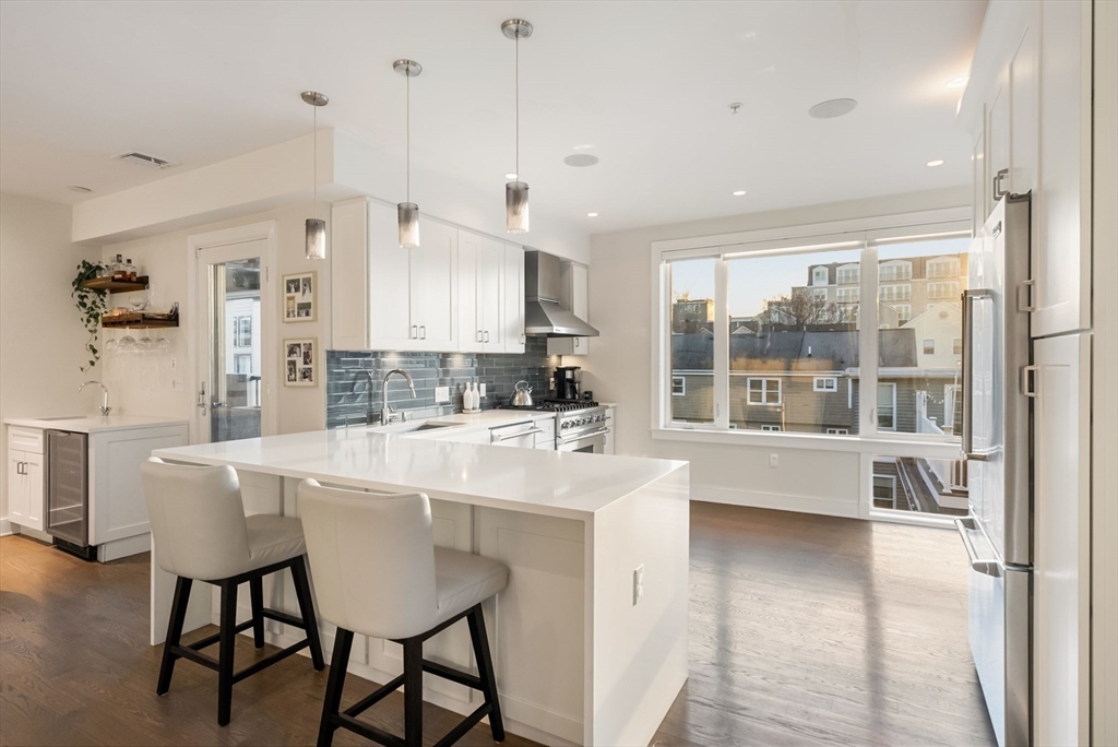 405 West First Street, Unit 303 Boston, MA 02127 - Photo 2 of 29 a large white kitchen with a large window