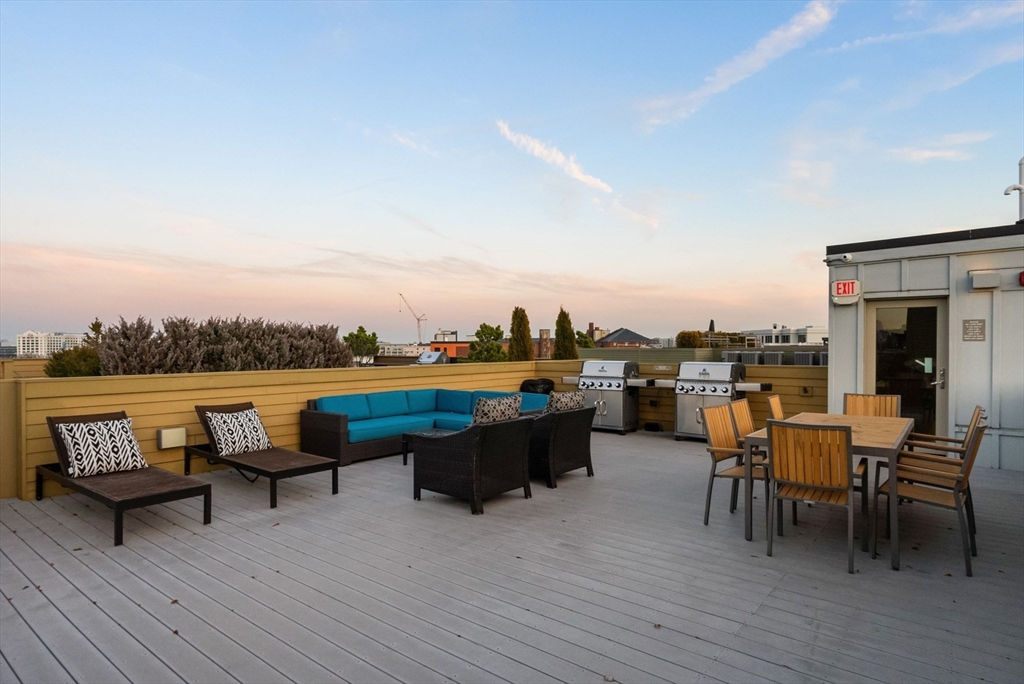 405 West First Street, Unit 303 Boston, MA 02127 - Photo 23 of 29 a swimming pool with lounge chair in front of house