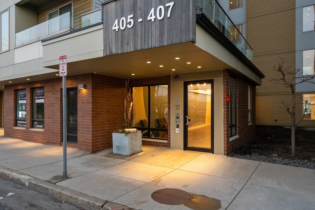 405 West First Street, Unit 303 Boston, MA 02127 - Photo 27 of 29 a front view of a building with seating space