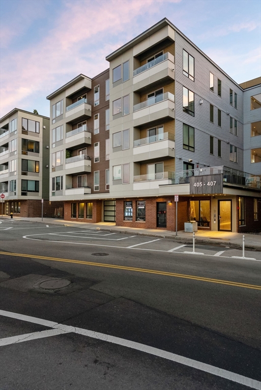 405 West First Street, Unit 303 Boston, MA 02127 - Photo 28 of 29 a view of a building with a balcony