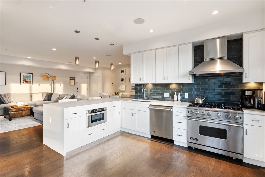 405 West First Street, Unit 303 Boston, MA 02127 - Photo 3 of 29 a kitchen with a stove top oven sink and cabinets