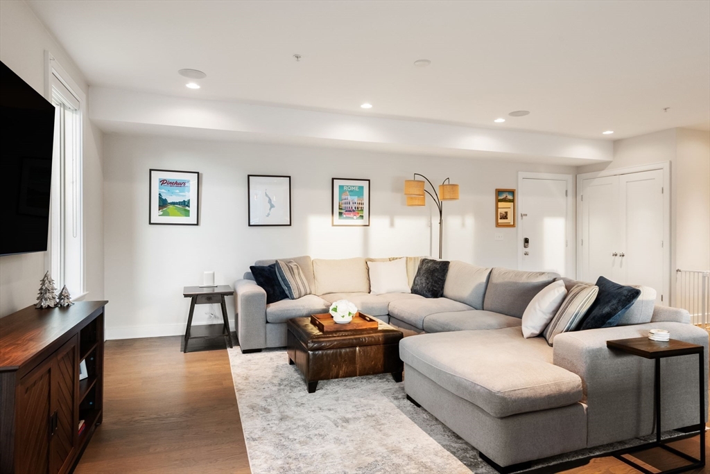 405 West First Street, Unit 303 Boston, MA 02127 - Photo 5 of 29 a living room with furniture and a flat screen tv