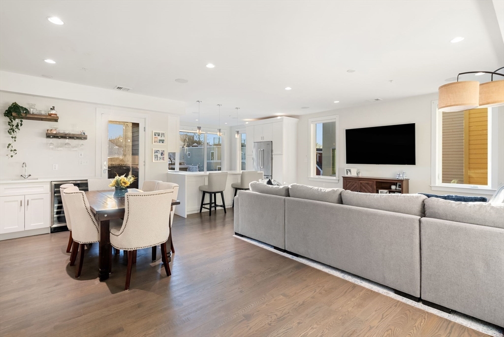 405 West First Street, Unit 303 Boston, MA 02127 - Photo 6 of 29 a living room with furniture and a flat screen tv