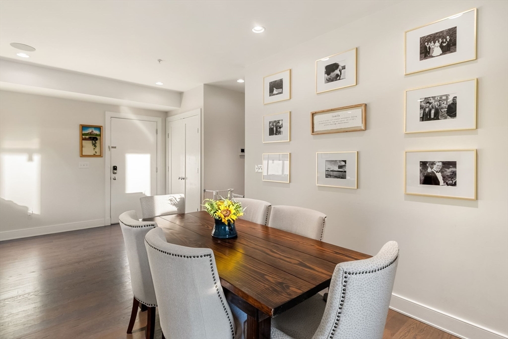 405 West First Street, Unit 303 Boston, MA 02127 - Photo 7 of 29 a view of a dining room with furniture and wooden floor