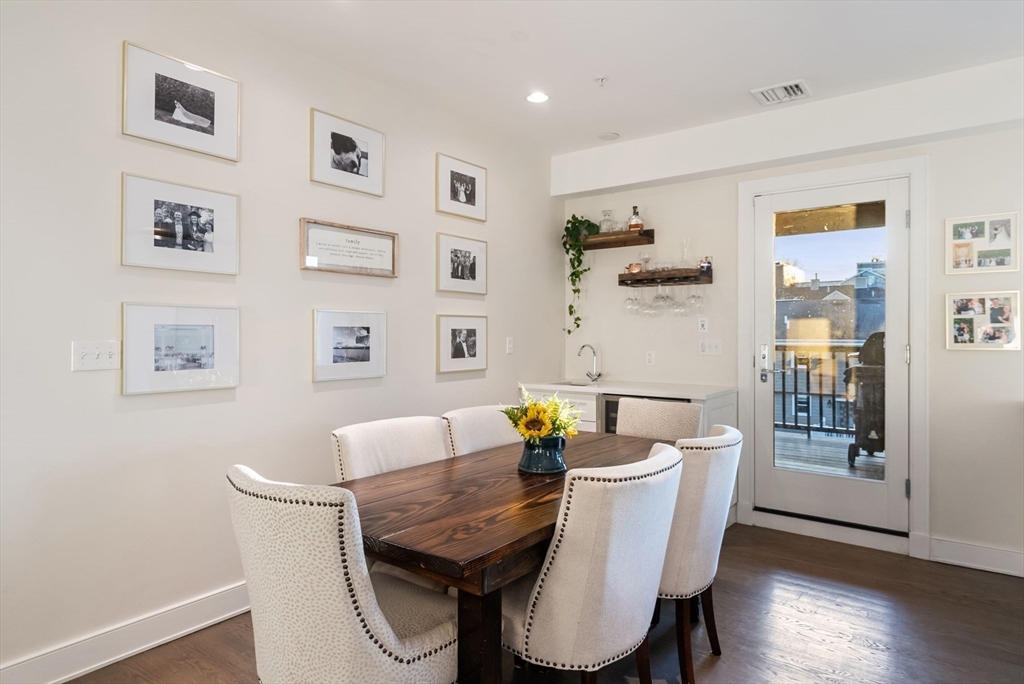 405 West First Street, Unit 303 Boston, MA 02127 - Photo 9 of 29 a dining room with furniture and wooden floor