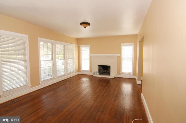 1542 Chain Bridge Road McLean, VA 22101 - Photo 3 of 22 Living room with wood burning fireplace