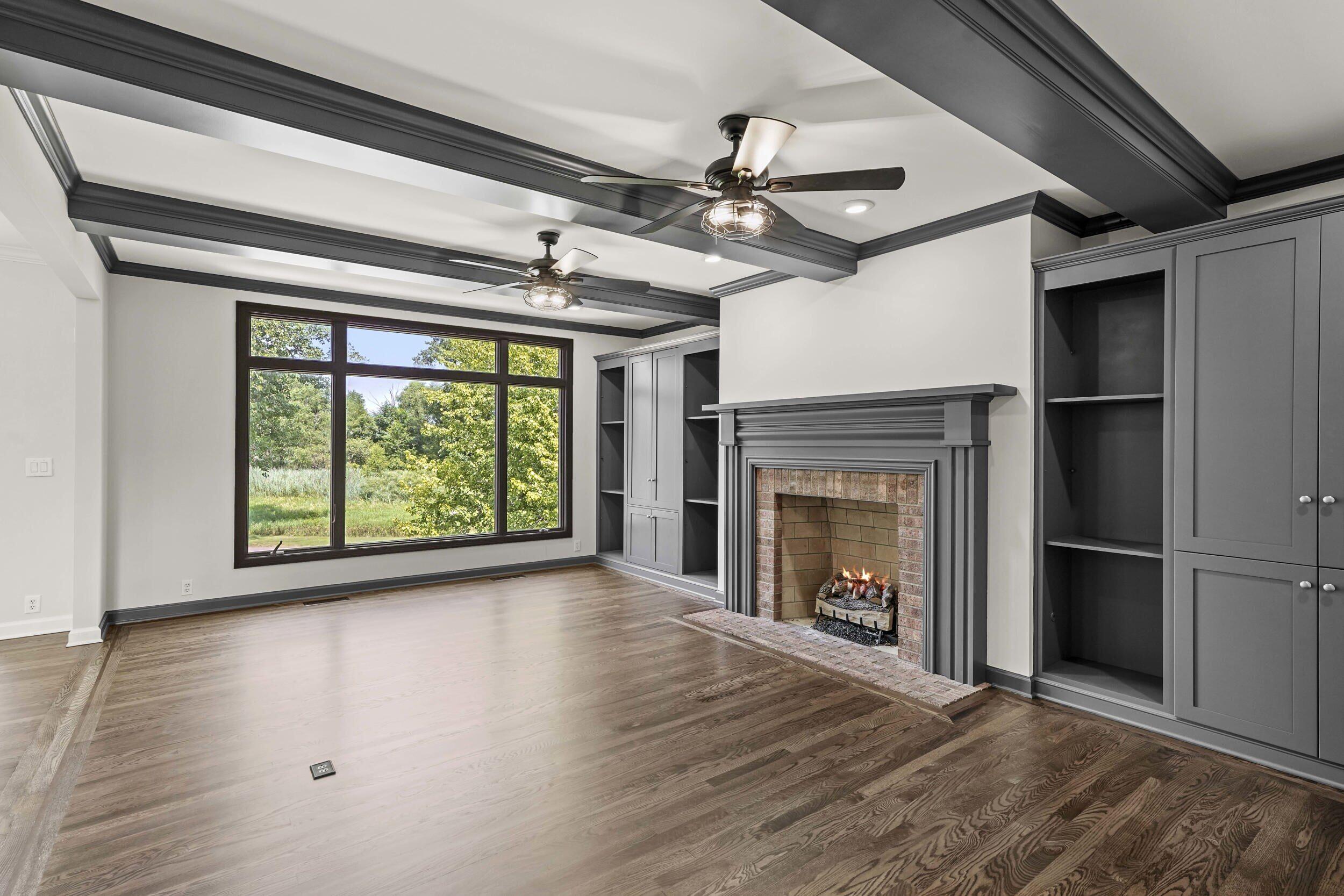 1500 Nelson Drive Chesterton, IN 46304 - Photo 21 of 70 a view of an empty room with a fireplace and a window