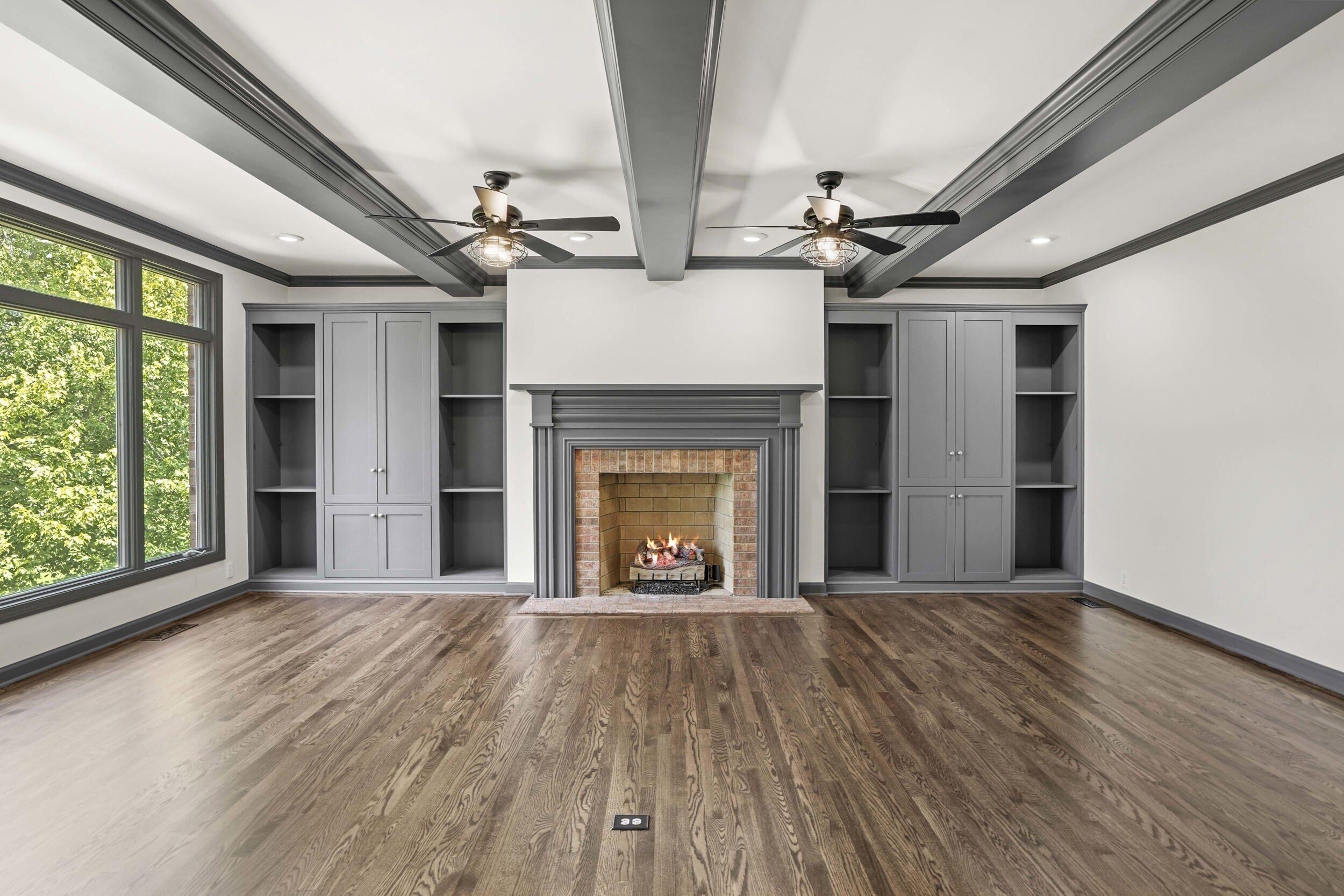 1500 Nelson Drive Chesterton, IN 46304 - Photo 23 of 70 a view of an empty room with wooden floor fireplace and a window